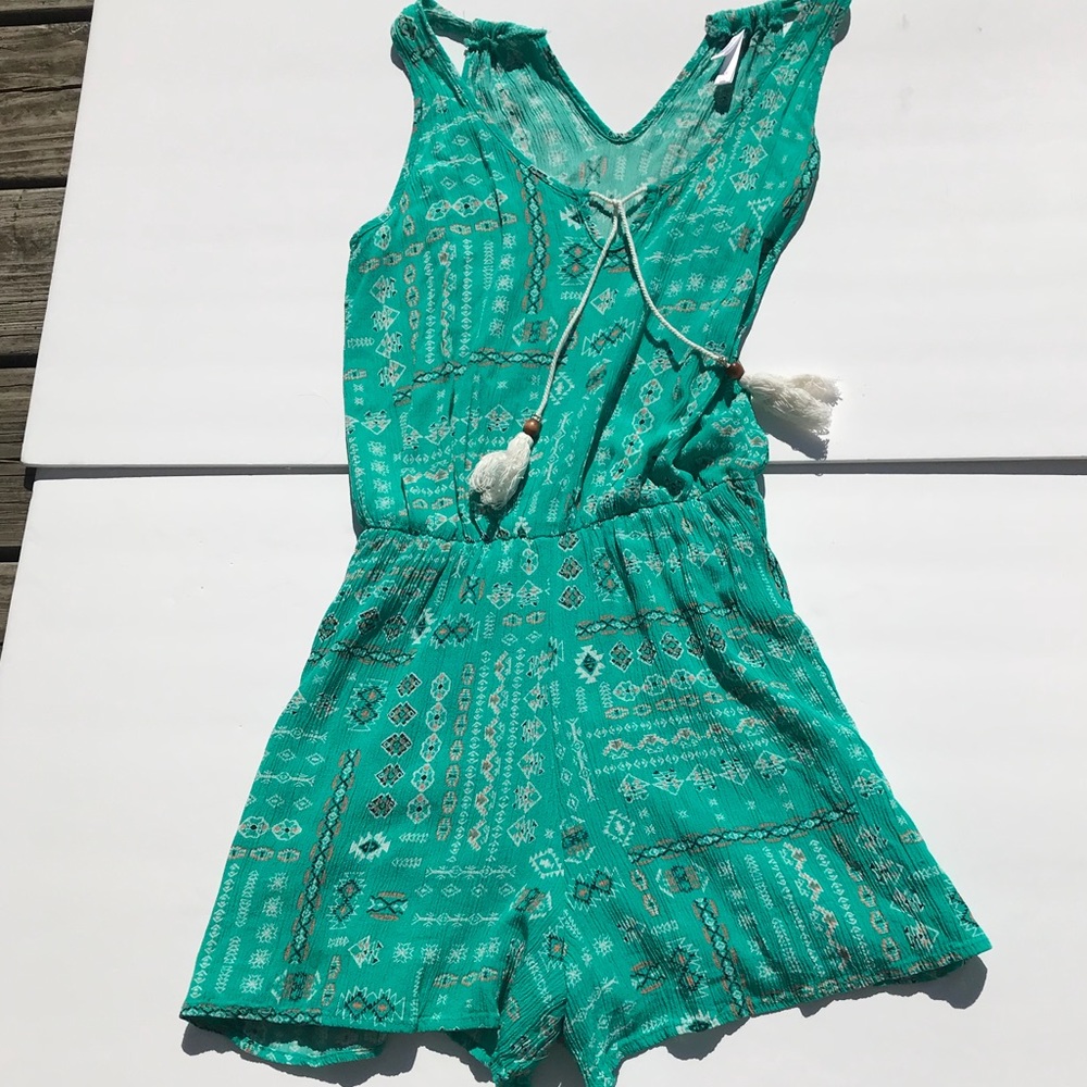 Fun boho romper with tassels.